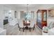 Formal dining room boasts hardwood floors, a chandelier, and a built-in china cabinet at 6217 Muirlands Ct, Las Vegas, NV 89130