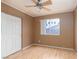 Cozy bedroom with laminate floors, neutral walls, closet and a window view at 6440 Break Point Ave, Las Vegas, NV 89130