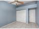 Bedroom with neutral paint, tile flooring, standard closet, and ceiling fan at 6440 Break Point Ave, Las Vegas, NV 89130