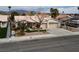 A well-maintained home featuring a desert landscaped front yard and a three-car garage at 6440 Break Point Ave, Las Vegas, NV 89130