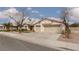 Attractive single-Gathering home showcasing a two-car garage, low-maintenance landscaping, and a well-kept driveway at 6440 Break Point Ave, Las Vegas, NV 89130