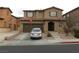 Charming two-story home with a two-car garage, landscaped front yard, and a warm, inviting entrance at 668 Moonlight Stroll St, Henderson, NV 89002