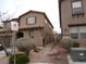 A view of the side of the home, highlighting the landscaping and architectural elements of the property at 668 Moonlight Stroll St, Henderson, NV 89002