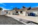Expansive backyard featuring a concrete area and rock landscaping, offering a versatile outdoor space at 6782 Bonillo Dr, Las Vegas, NV 89103