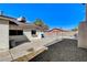 View of the backyard featuring a mix of rock landscaping and concrete, offering a simple outdoor retreat at 6782 Bonillo Dr, Las Vegas, NV 89103