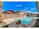 An in-ground pool is beautifully integrated into the expansive backyard, creating a private retreat at 6782 Bonillo Dr, Las Vegas, NV 89103