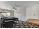 Bedroom showcasing tile floors, fan, and natural lighting at 6782 Bonillo Dr, Las Vegas, NV 89103