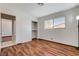 Bedroom featuring wood floors and a view into adjoining room at 6782 Bonillo Dr, Las Vegas, NV 89103