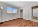 Bright bedroom featuring wood floors, closet, and window at 6782 Bonillo Dr, Las Vegas, NV 89103