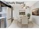 Staged dining area featuring modern appliances at 6782 Bonillo Dr, Las Vegas, NV 89103