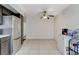 Open dining area featuring stainless steel fridge at 6782 Bonillo Dr, Las Vegas, NV 89103
