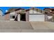 Charming single-story home with a two-car garage and low maintenance desert landscaping at 6782 Bonillo Dr, Las Vegas, NV 89103