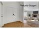 Virtually staged foyer featuring brick flooring and entry to the living room at 6782 Bonillo Dr, Las Vegas, NV 89103