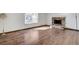 Living room featuring a brick fireplace and hardwood flooring at 6782 Bonillo Dr, Las Vegas, NV 89103