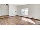 Living room featuring a brick fireplace, hardwood flooring and lots of natural light at 6782 Bonillo Dr, Las Vegas, NV 89103