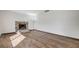 Living room featuring a brick fireplace and hardwood flooring at 6782 Bonillo Dr, Las Vegas, NV 89103