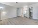 This virtually staged main bedroom features light wood-look floors, a walk-in closet, and an ensuite bathroom at 6782 Bonillo Dr, Las Vegas, NV 89103