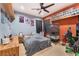 Bedroom with a ceiling fan, shelves, and posters at 7904 Mountain Point Ave, Las Vegas, NV 89131