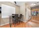 Cozy dining area with table and seating beside a glass cabinet at 7904 Mountain Point Ave, Las Vegas, NV 89131