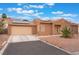 Charming single-story home with desert landscaping, solar panels, and a two-car garage at 7904 Mountain Point Ave, Las Vegas, NV 89131