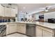 Bright kitchen with granite countertops and stainless steel appliances at 7904 Mountain Point Ave, Las Vegas, NV 89131