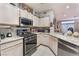 Modern kitchen featuring granite countertops, stainless steel appliances, and ample cabinet space at 7904 Mountain Point Ave, Las Vegas, NV 89131