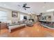 Spacious living room with wood floors and bar seating at the kitchen counter at 7904 Mountain Point Ave, Las Vegas, NV 89131