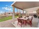 Inviting covered patio featuring a dining table and chairs, perfect for outdoor entertaining at 7904 Mountain Point Ave, Las Vegas, NV 89131