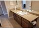 Bathroom featuring a granite countertop, a mirror, and a tile floor at 8101 W Flamingo Rd # 2040, Las Vegas, NV 89147