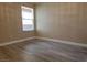 Bedroom featuring wood-look floors and a window at 8101 W Flamingo Rd # 2040, Las Vegas, NV 89147