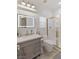 Bathroom with gray vanity, shower, and toilet at 8425 Cambrils Ave, Las Vegas, NV 89178