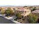 Suburban two-story home features a three-car garage, neutral color scheme, and drought-tolerant landscaping at 8425 Cambrils Ave, Las Vegas, NV 89178