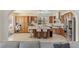 Eat-in kitchen with island, bar seating, stainless steel appliances, and ample cabinet space at 8425 Cambrils Ave, Las Vegas, NV 89178