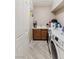 Functional laundry room including a washer, dryer, and a sink at 8425 Cambrils Ave, Las Vegas, NV 89178