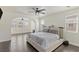 Spacious main bedroom with an archway leading to an additional sitting area with hardwood floors and natural light at 8425 Cambrils Ave, Las Vegas, NV 89178
