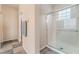 Bright bathroom features a glass-enclosed shower with unique window block at 8506 River Ridge Dr, Las Vegas, NV 89131