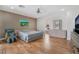 Relaxing bedroom featuring hardwood floors, ceiling fan, and neutral color scheme at 8506 River Ridge Dr, Las Vegas, NV 89131