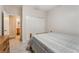 Cozy bedroom featuring plush carpet and an ensuite bathroom entrance at 8506 River Ridge Dr, Las Vegas, NV 89131