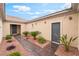 Enclosed courtyard with desert landscaping and private entrances to the residence at 8506 River Ridge Dr, Las Vegas, NV 89131