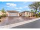 Charming single-story home with a well-manicured front yard and three car garage at 8506 River Ridge Dr, Las Vegas, NV 89131