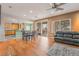 Open floor plan featuring hardwood floors, dining area and sliding door to backyard at 8506 River Ridge Dr, Las Vegas, NV 89131
