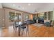 Open living area with hardwood floors, dining space and sliding glass doors to the backyard at 8506 River Ridge Dr, Las Vegas, NV 89131