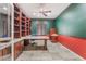 Office with custom built-in bookshelves, and neutral tiled floors at 8506 River Ridge Dr, Las Vegas, NV 89131