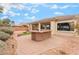 Stylish outdoor kitchen area on a brick patio, perfect for entertaining guests at 8506 River Ridge Dr, Las Vegas, NV 89131
