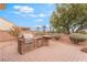 Built-in outdoor kitchen and barbecue area with counter seating, ideal for outdoor dining at 8506 River Ridge Dr, Las Vegas, NV 89131