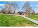 Community playground surrounded by lush green grass and mature trees at 8506 River Ridge Dr, Las Vegas, NV 89131