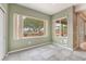 Cozy room with tiled floors with a view of the backyard patio at 8506 River Ridge Dr, Las Vegas, NV 89131
