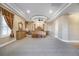 Large main bedroom with carpet, canopy bed, tray ceiling, and lots of natural light at 8509 Iron Mountain Rd, Las Vegas, NV 89143