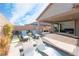 Relaxing backyard with pool, lounge chairs, built-in grill and covered patio at 8648 Cloverbelle St, Las Vegas, NV 89166