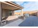 Spacious outdoor area includes outdoor kitchen, lounge chairs and pavers at 8648 Cloverbelle St, Las Vegas, NV 89166